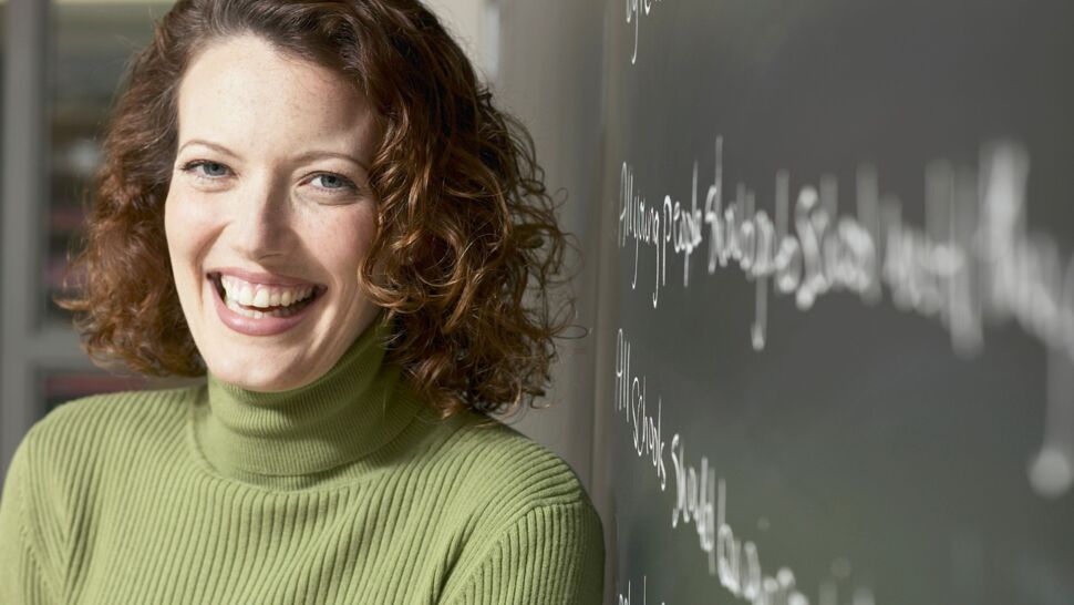 teacher-leaning-against-blackboard