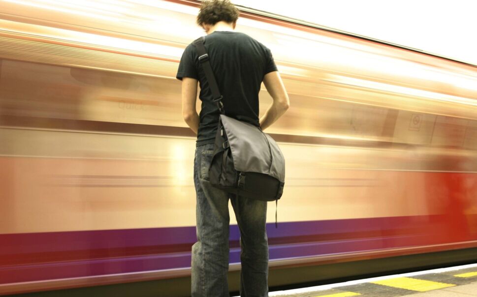 man-standing-on-metro-platform