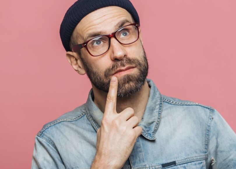 man-with-glasses-and-beanie-thinking man-with-glasses-and-beanie-thinking