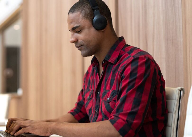 man-working-with-headphones-on