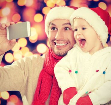 Father-taking-christmas-picture-with-son